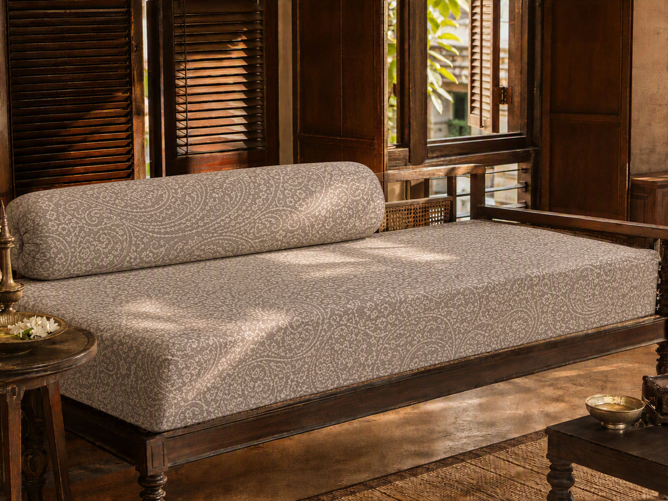 Traditional dark wood divan with turned legs, a patterned grey and white upholstered mattress - Beautiful Homes