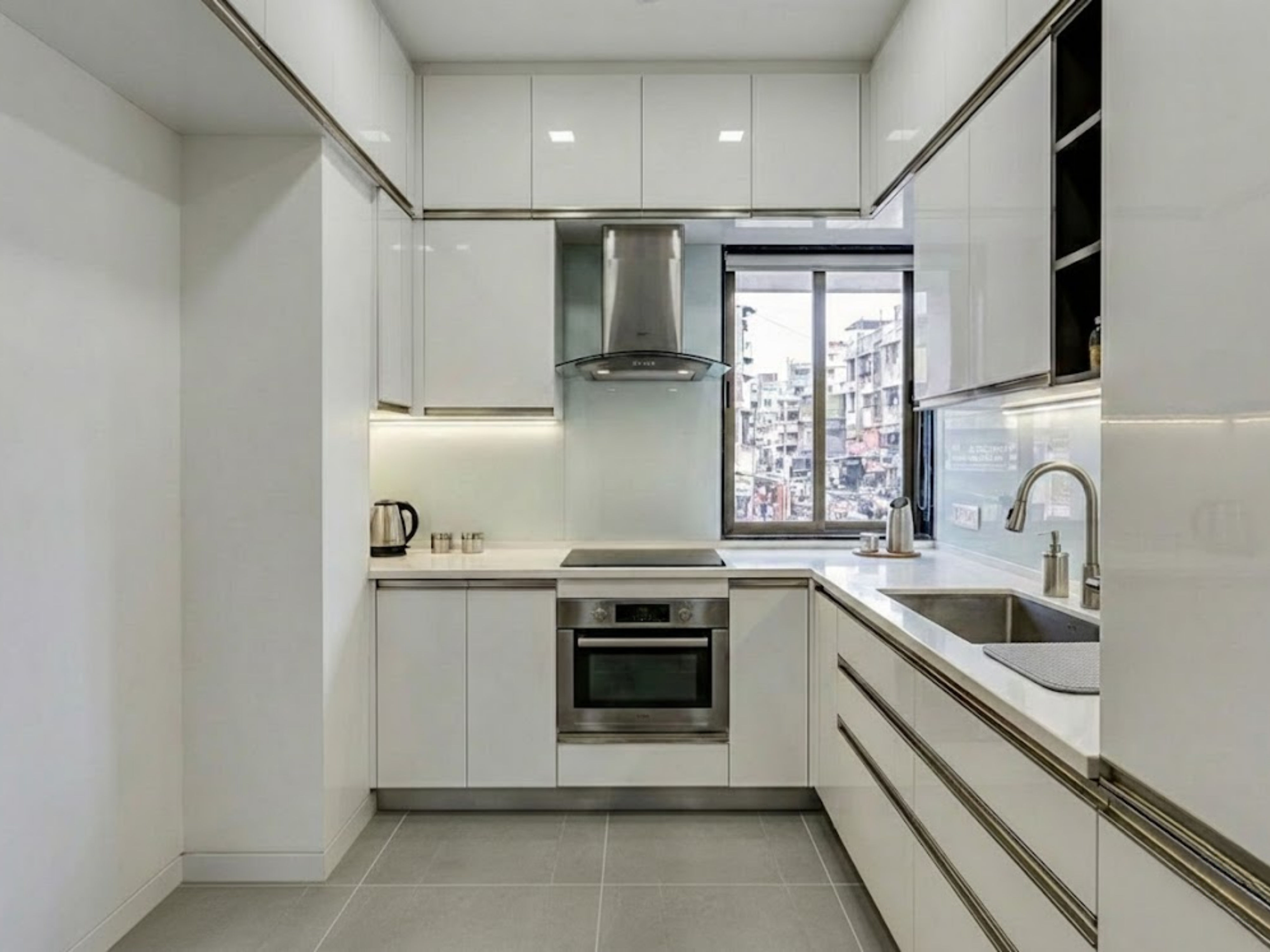 Modern kitchen with wooden cabinets and white tiles - Beautiful Homes