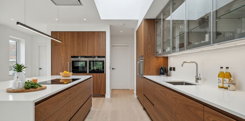Modern kitchen with wooden cabinets and marble countertops - Beautiful Homes