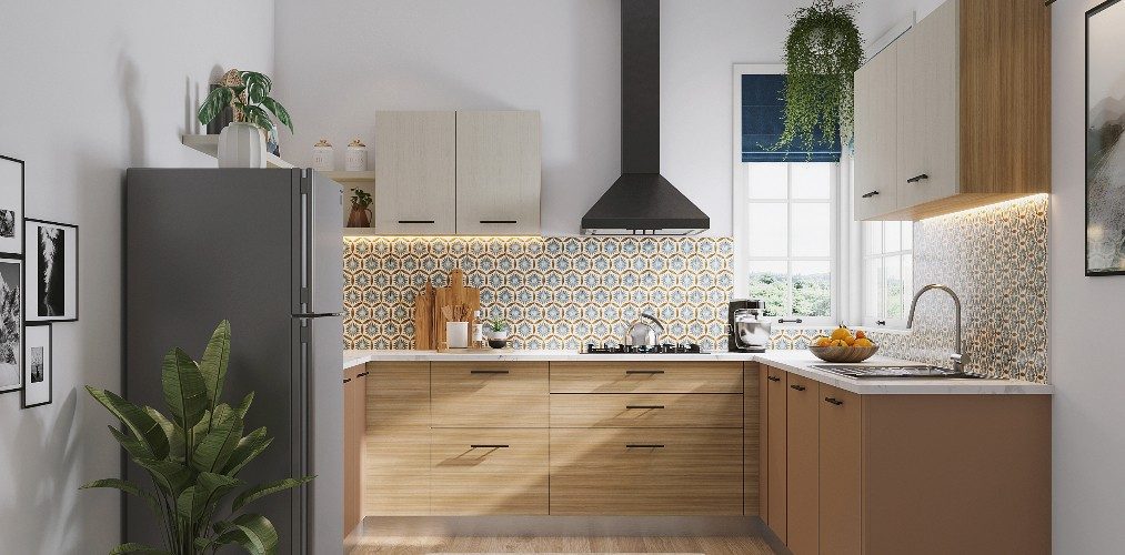 Cream coloured C-shaped kitchen design with designer wall tiles-Beautiful Homes