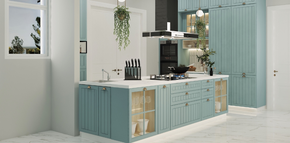 Kitchen cabinet design with blue laminate with grooves and golden knobs-Beautiful Homes