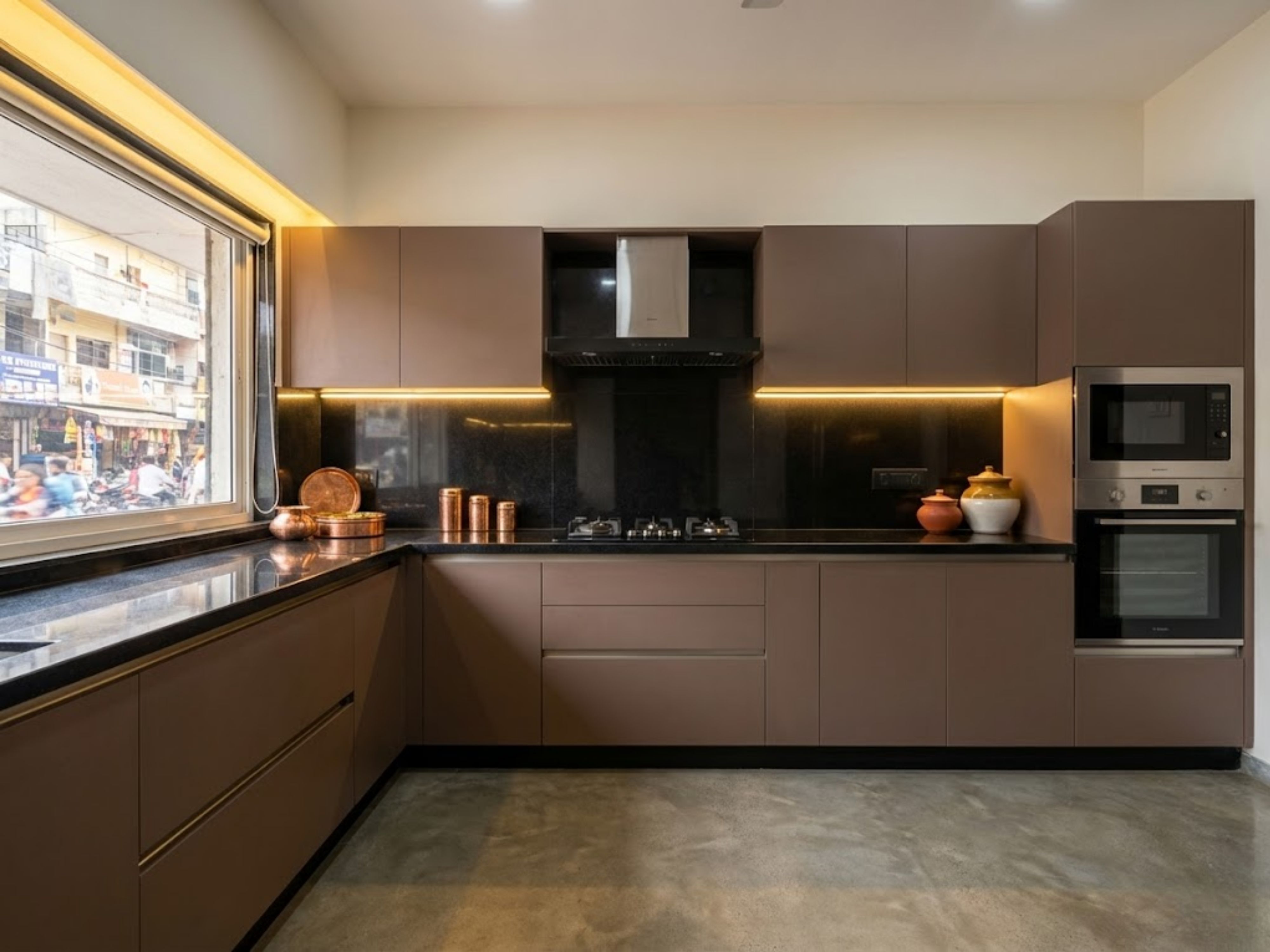 L-shaped kitchen with brown cabinets and marble countertop - Beautiful Homes