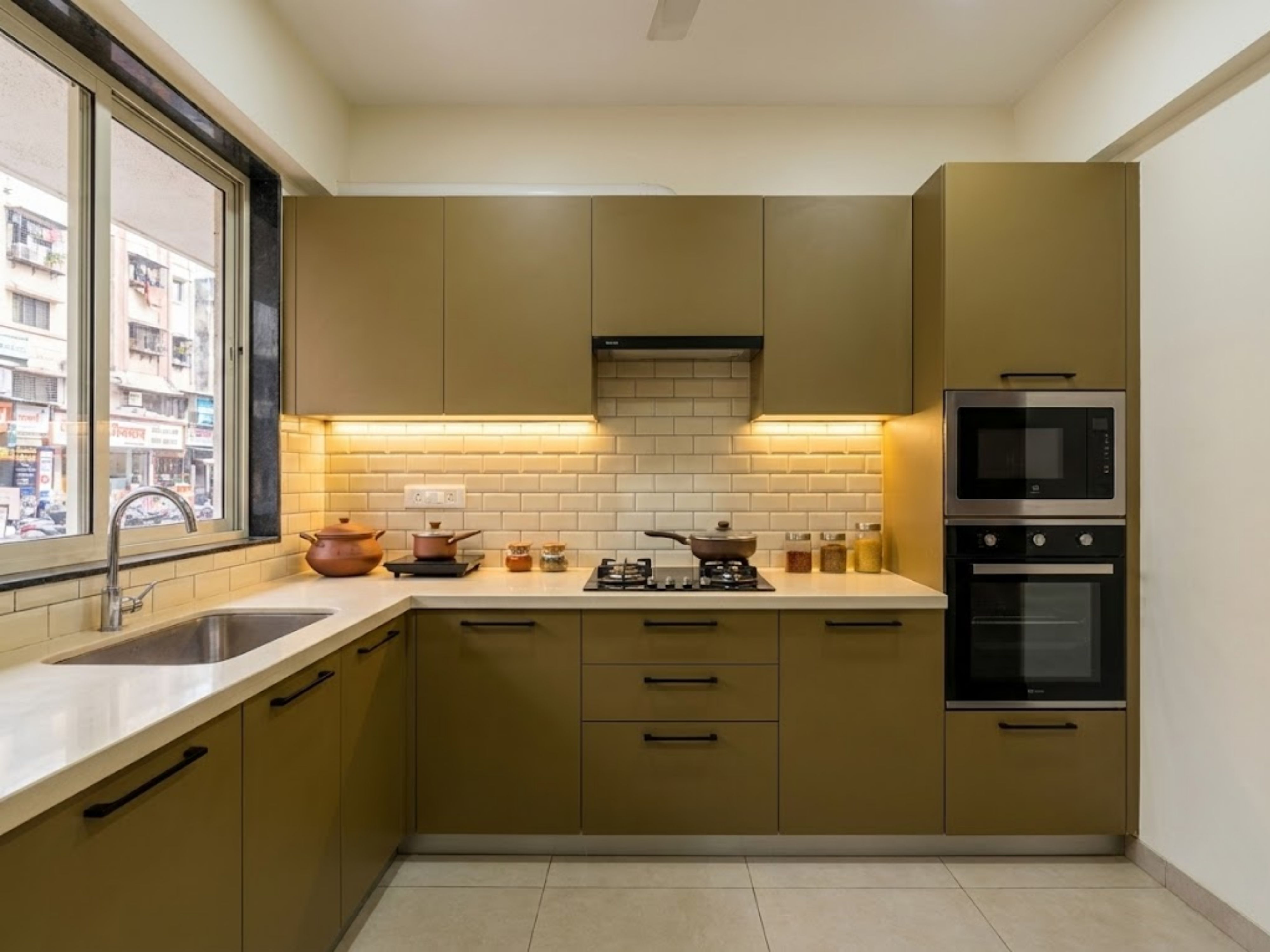 Modern kitchen with olive cabinets and marble countertop - Beautiful Homes