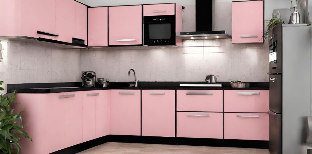 L-shaped kitchen with pink cabinets and black granite countertop - Beautiful Homes