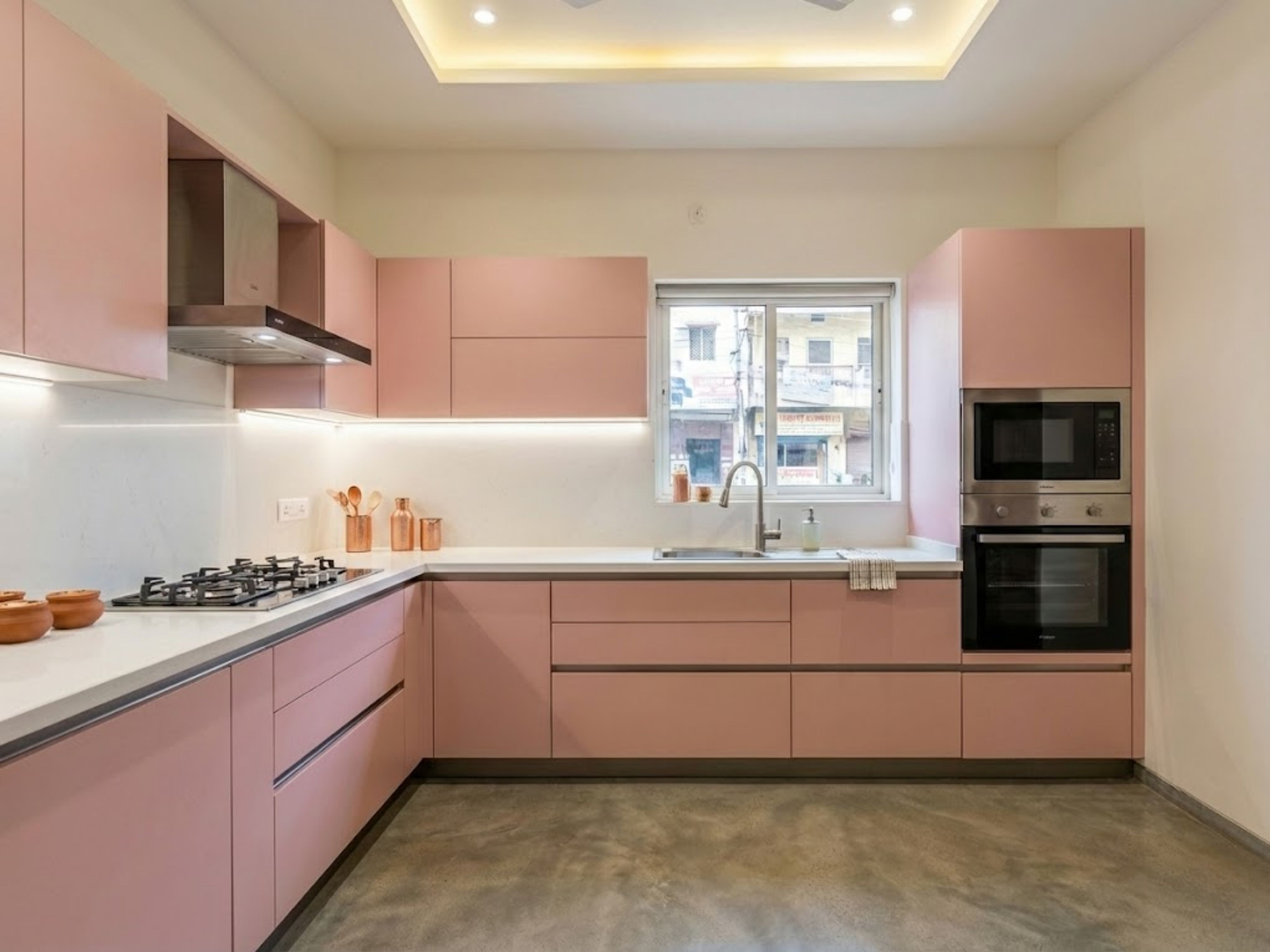 Stylish L shaped kitchen with pink cabinets - Beautiful Homes
