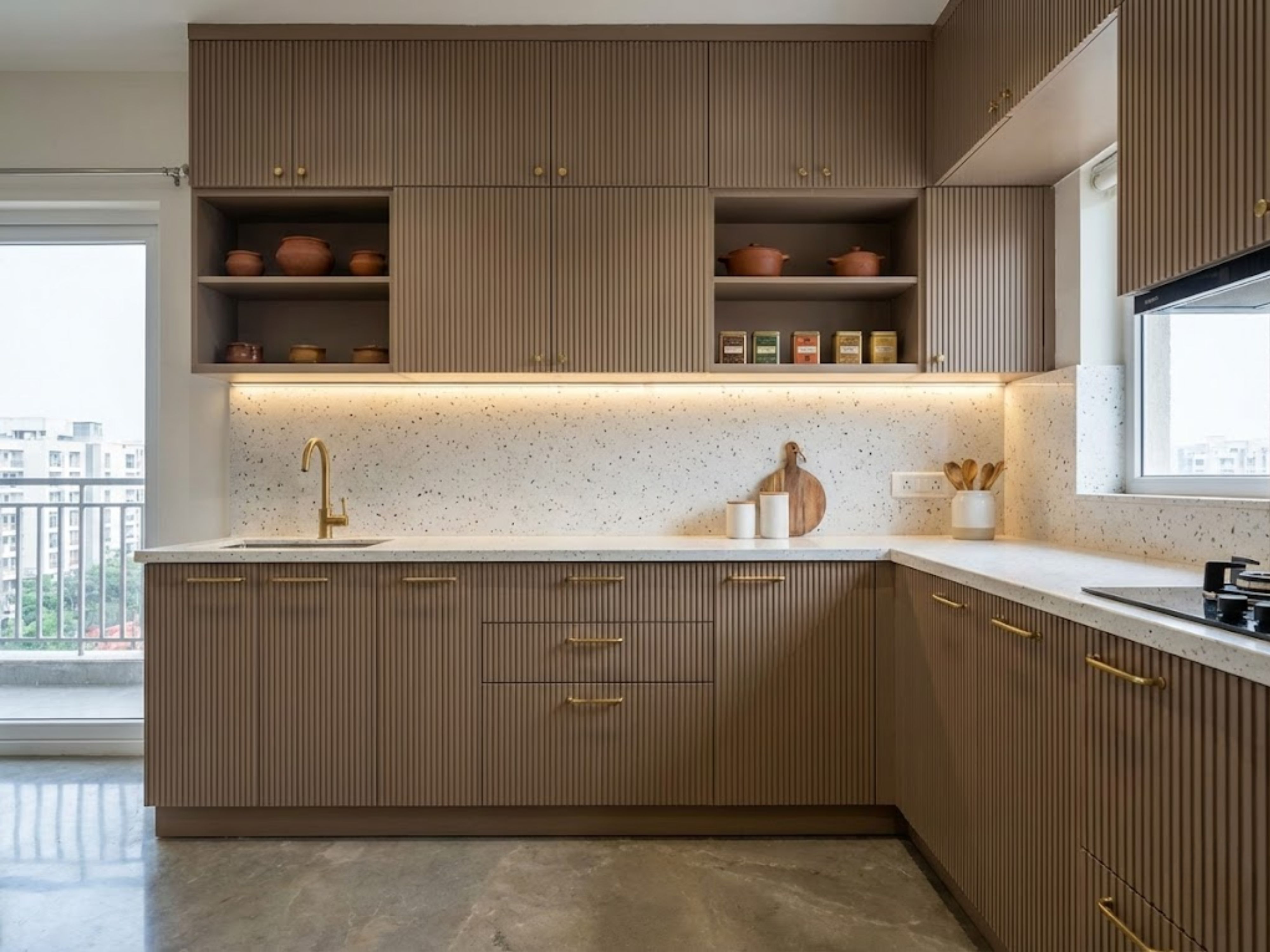 Modern L-shaped kitchen with terrazzo counters - Beautiful Homes