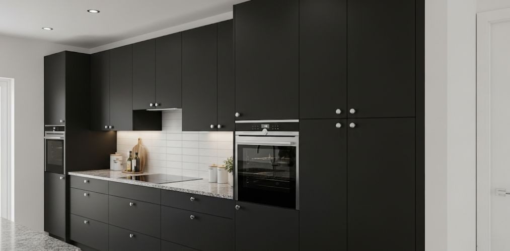 Black cabinets with white backsplash and granite counters - Beautiful Homes