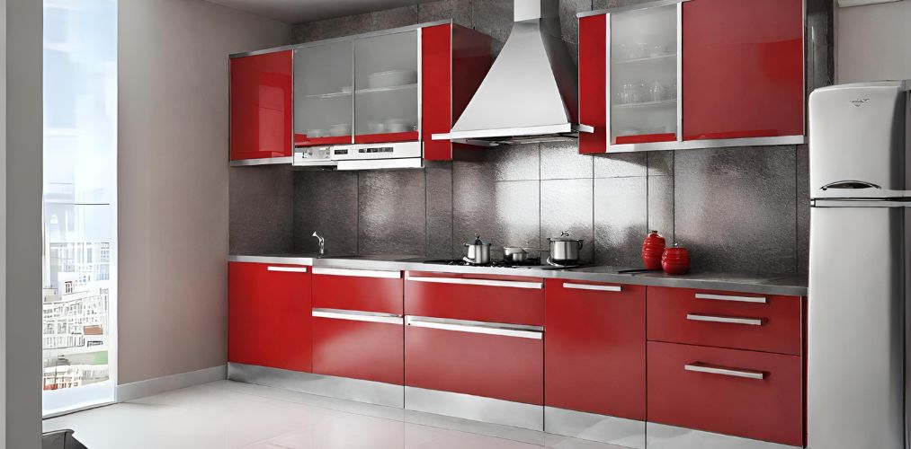 Red and silver straight kitchen with glossy backsplash-Beautiful Homes