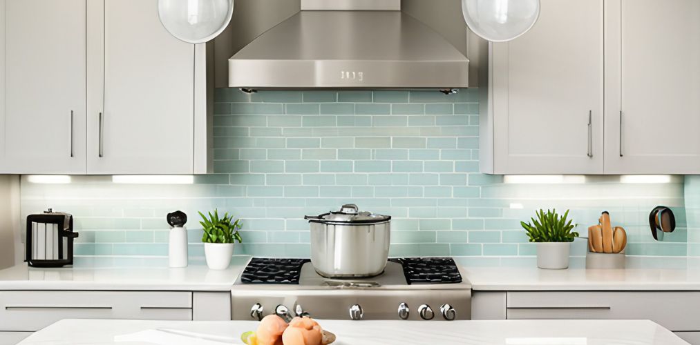 Small kitchen with pastel green backsplash tiles-Beautiful Homes
