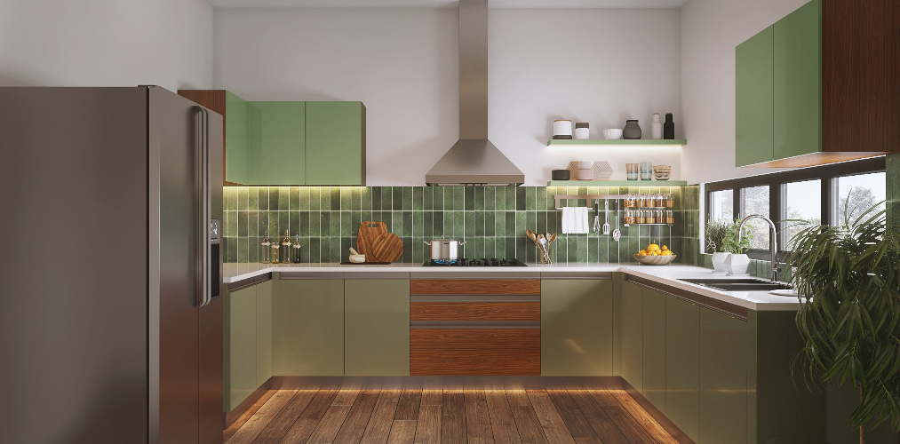 U shaped kitchen design with green kitchen cabinets & wooden floors-Beautiful Homes