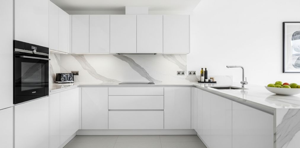Modern white kitchen with marble accents - Beautiful Homes