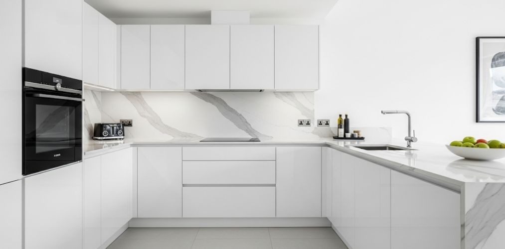 Modern white kitchen with marble accents - Beautiful Homes