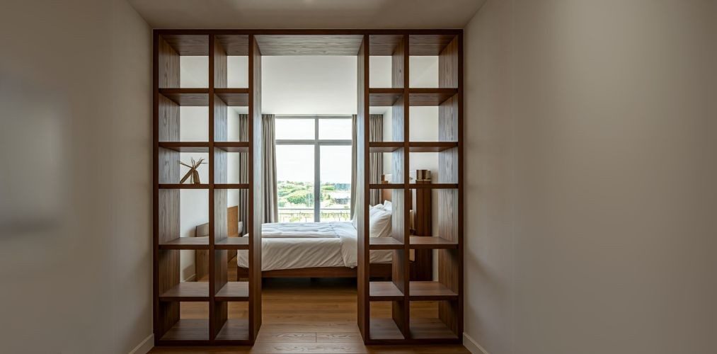 Partition design with display and storage shelves in bedroom - Beautiful Homes