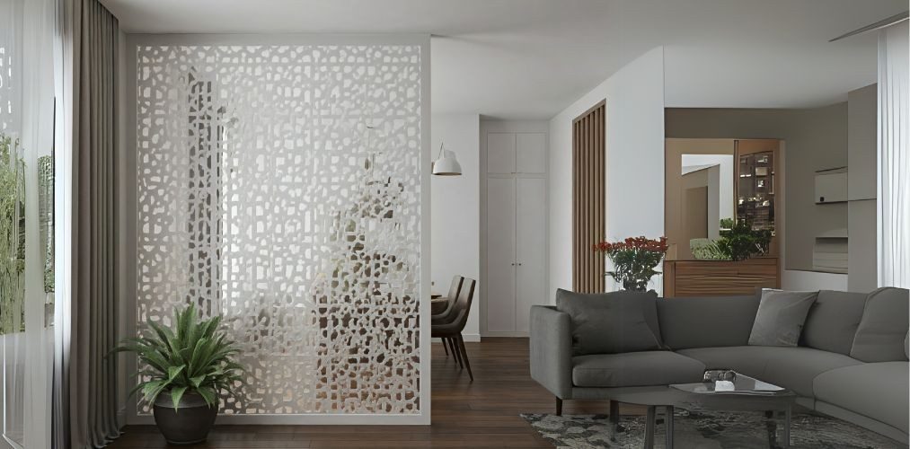 White jali partition between living room and dining area - Beautiful Homes