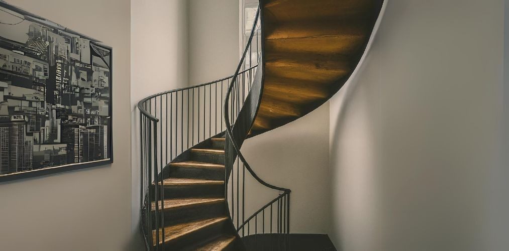 Black and wood spiral staircase with metal railing - Beautiful Homes