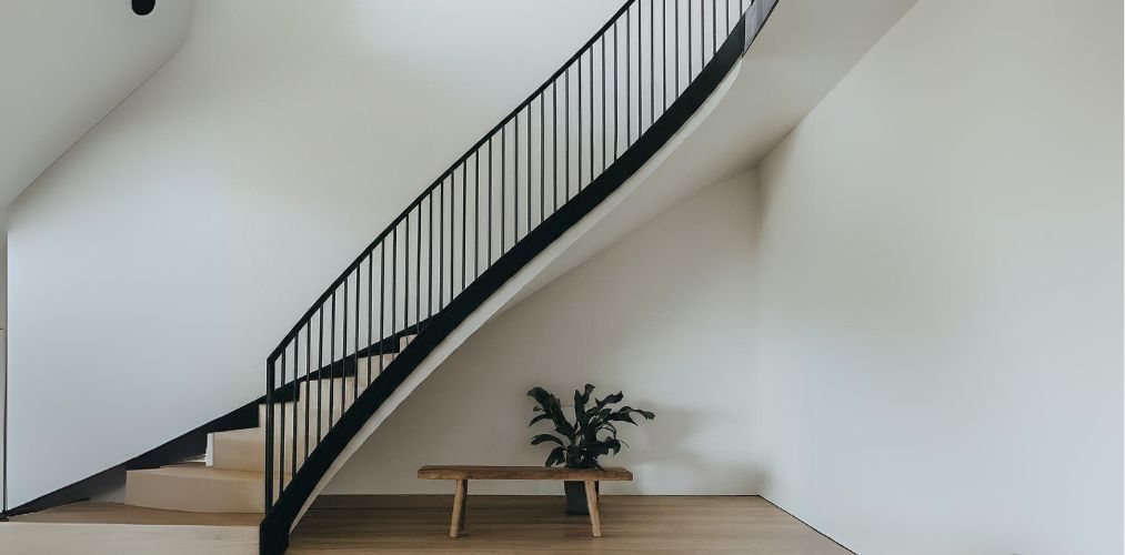 Simple iron railing for a curved staircase - Beautiful Homes