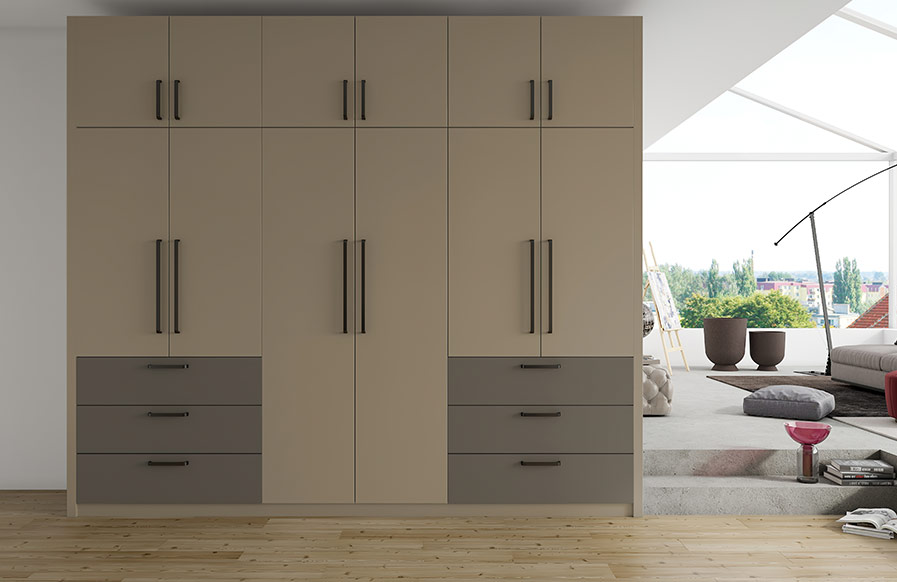 A modern bedroom cupboard design with multiple options for storage and a bed - Beautiful Homes