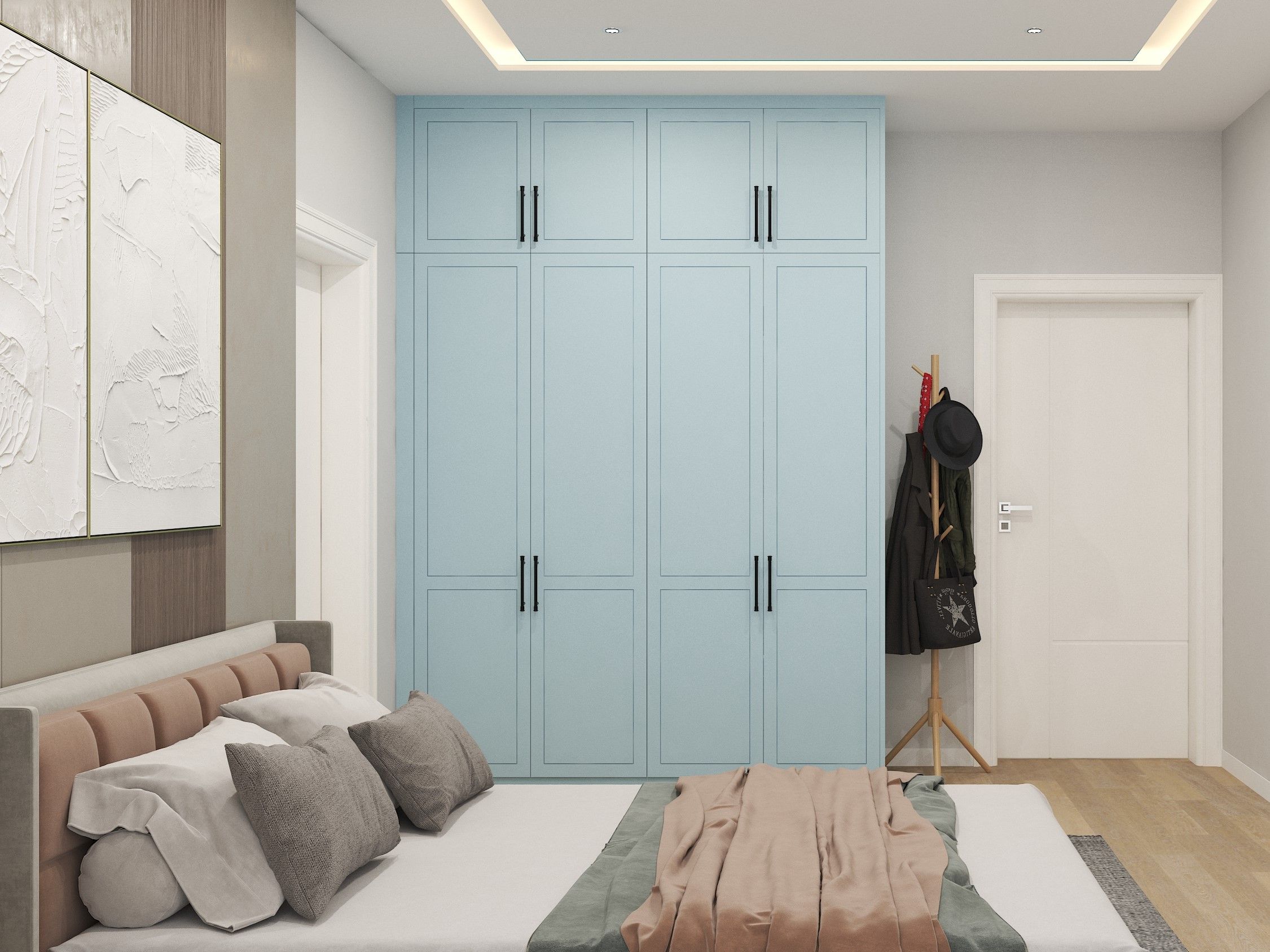 Blue wardrobe and wooden flooring in bedroom - Beautiful Homes