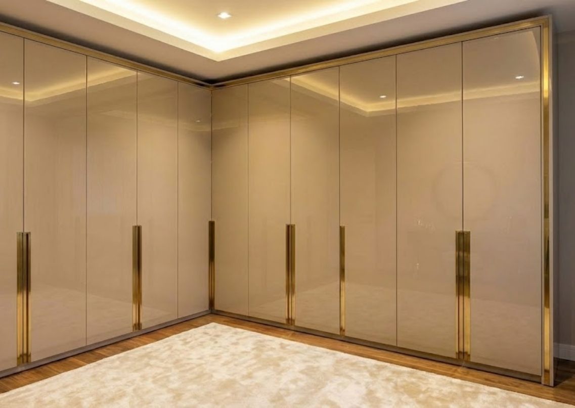 Glossy beige wardrobe with sliding panels - Beautiful Homes