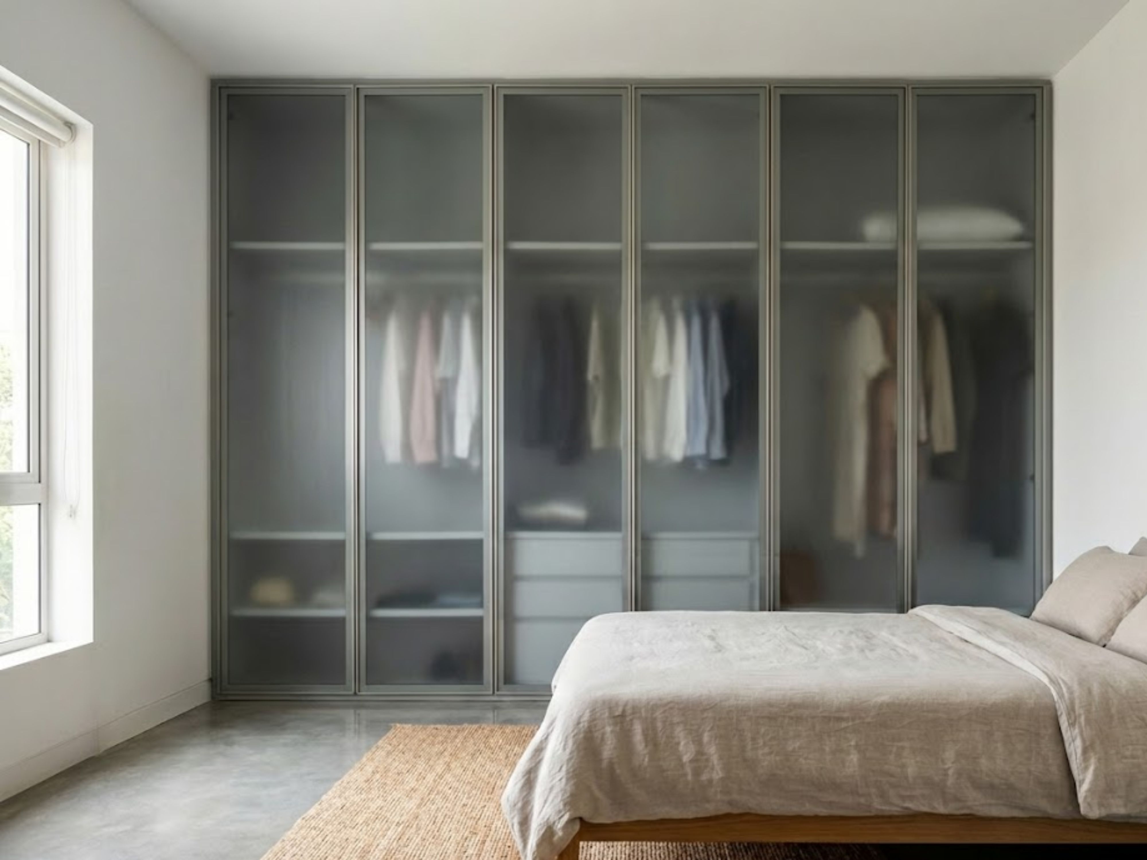 Bedroom with frosted glass wardrobe and natural light - Beautiful Homes