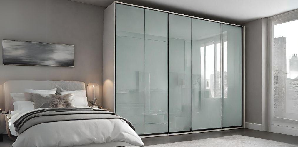 Modern wardrobe with glass shutter for guest bedroom-Beautiful Homes