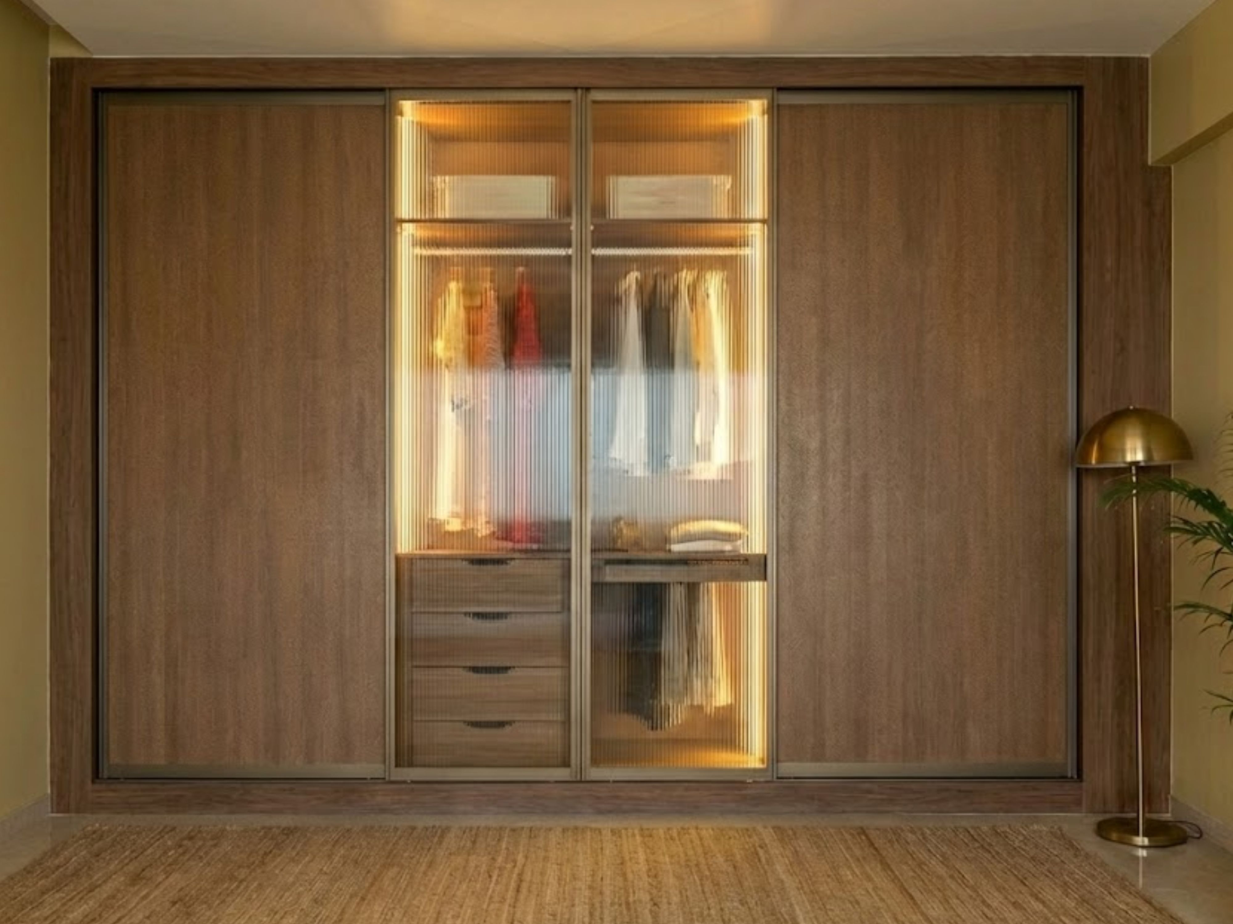 Wooden sliding wardrobe with glass panels and lighting - Beautiful Homes