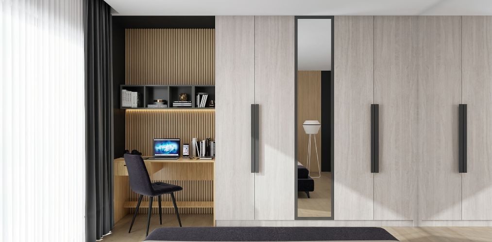 Wardrobe design for bedroom with mirror and computer table-Beautiful Homes