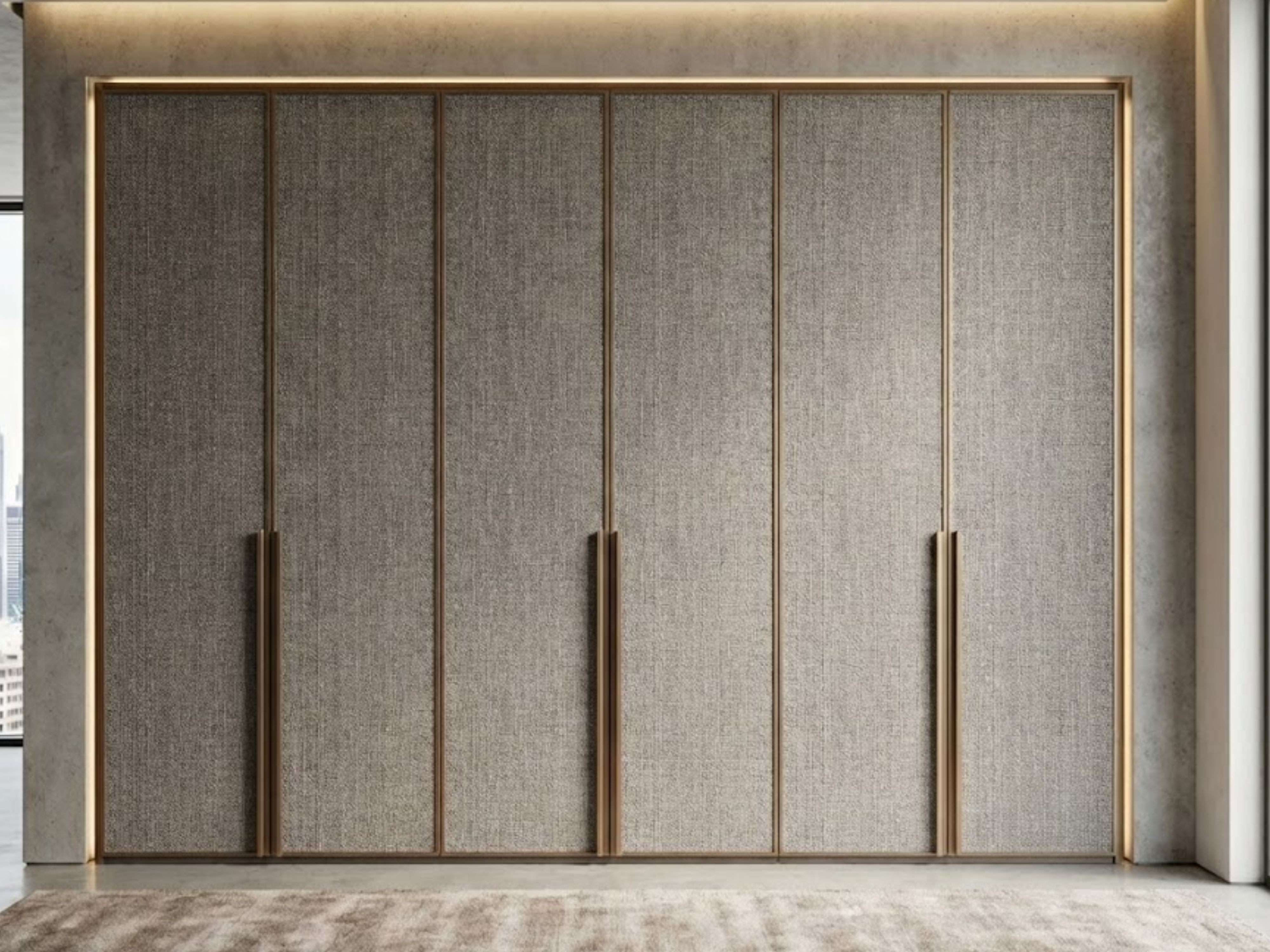 Modern sliding wardrobe with textured finish and golden handles - Beautiful Homes