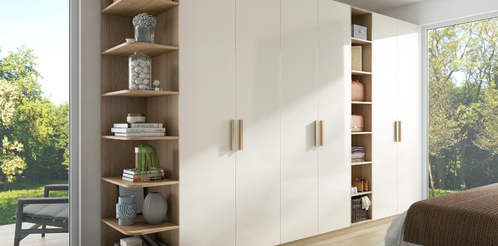 White almirah design with wooden handles and shelves-Beautiful Homes