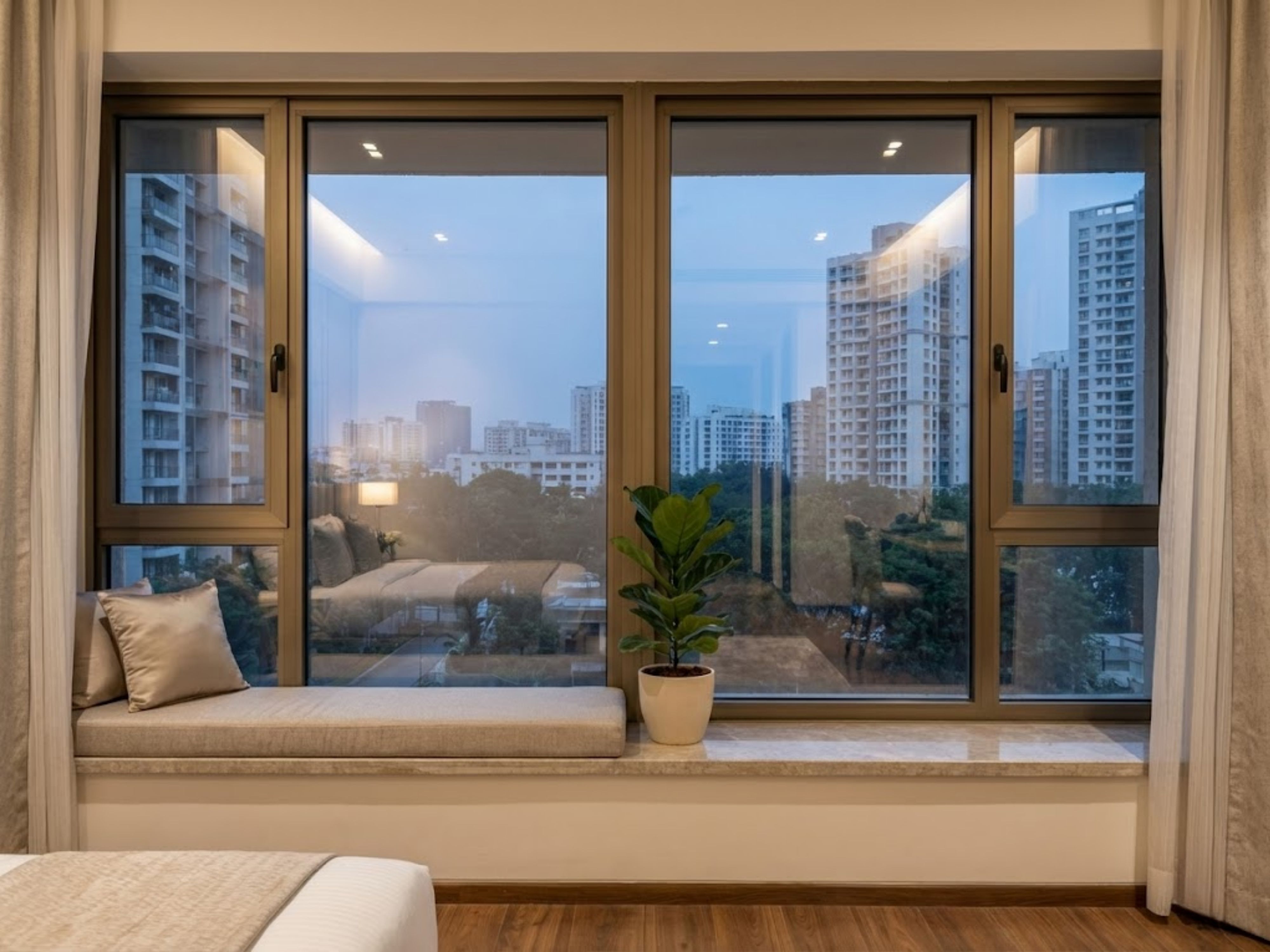 Bedroom with large windows and cozy seating area - Beautiful Homes