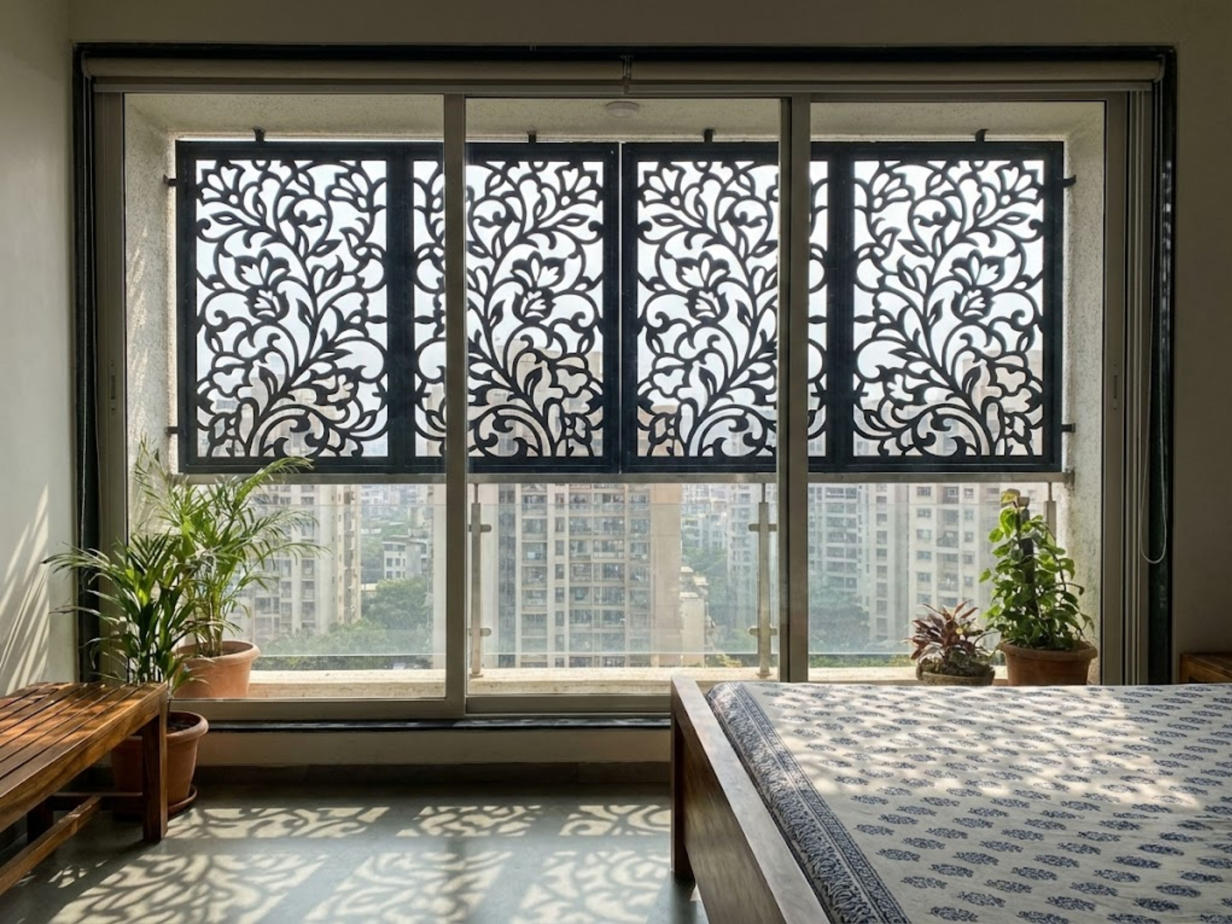 Modern balcony with geometric grill and warm lighting - Beautiful Homes