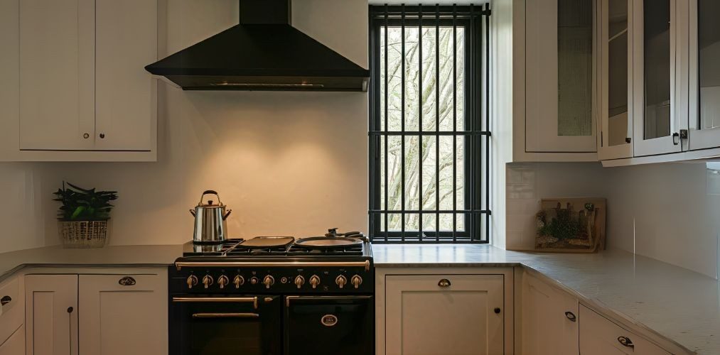 Small corner window with grill in kitchen - Beautiful Homes