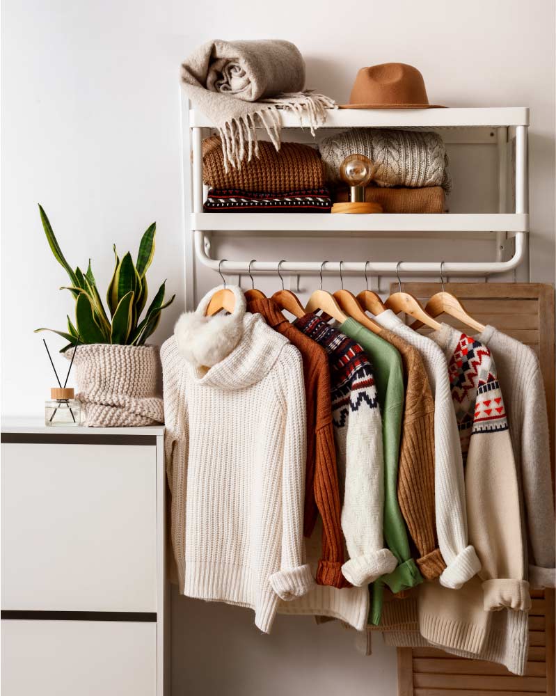 Woollen fabrics hanging on a shelf