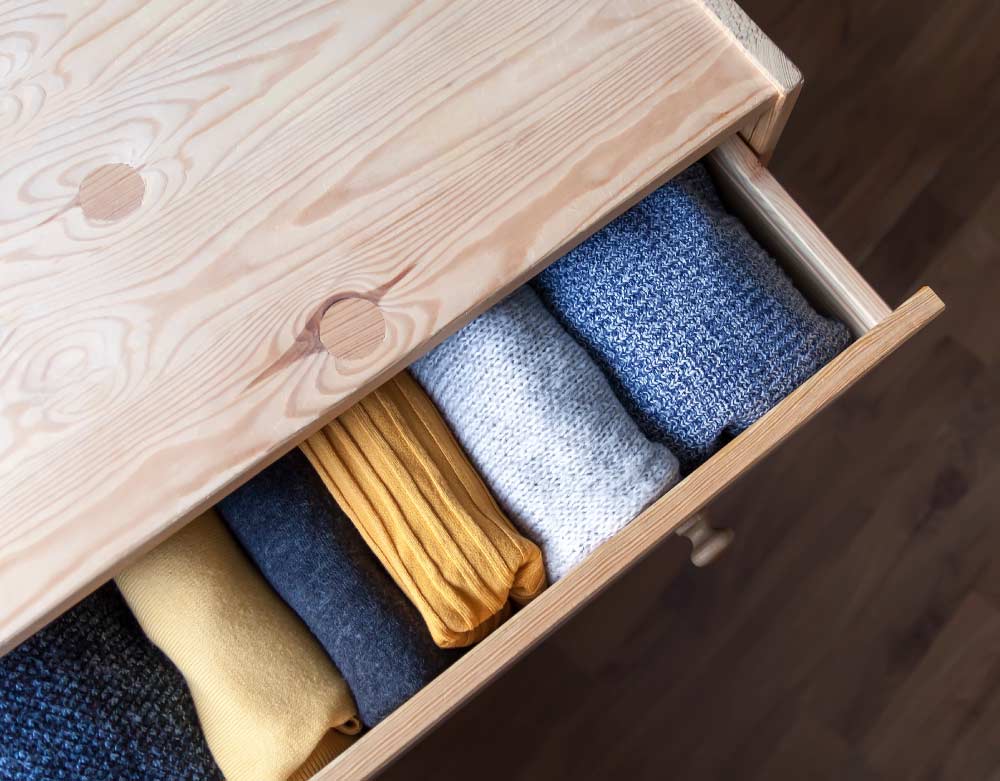 Woollen clothes in a drawer