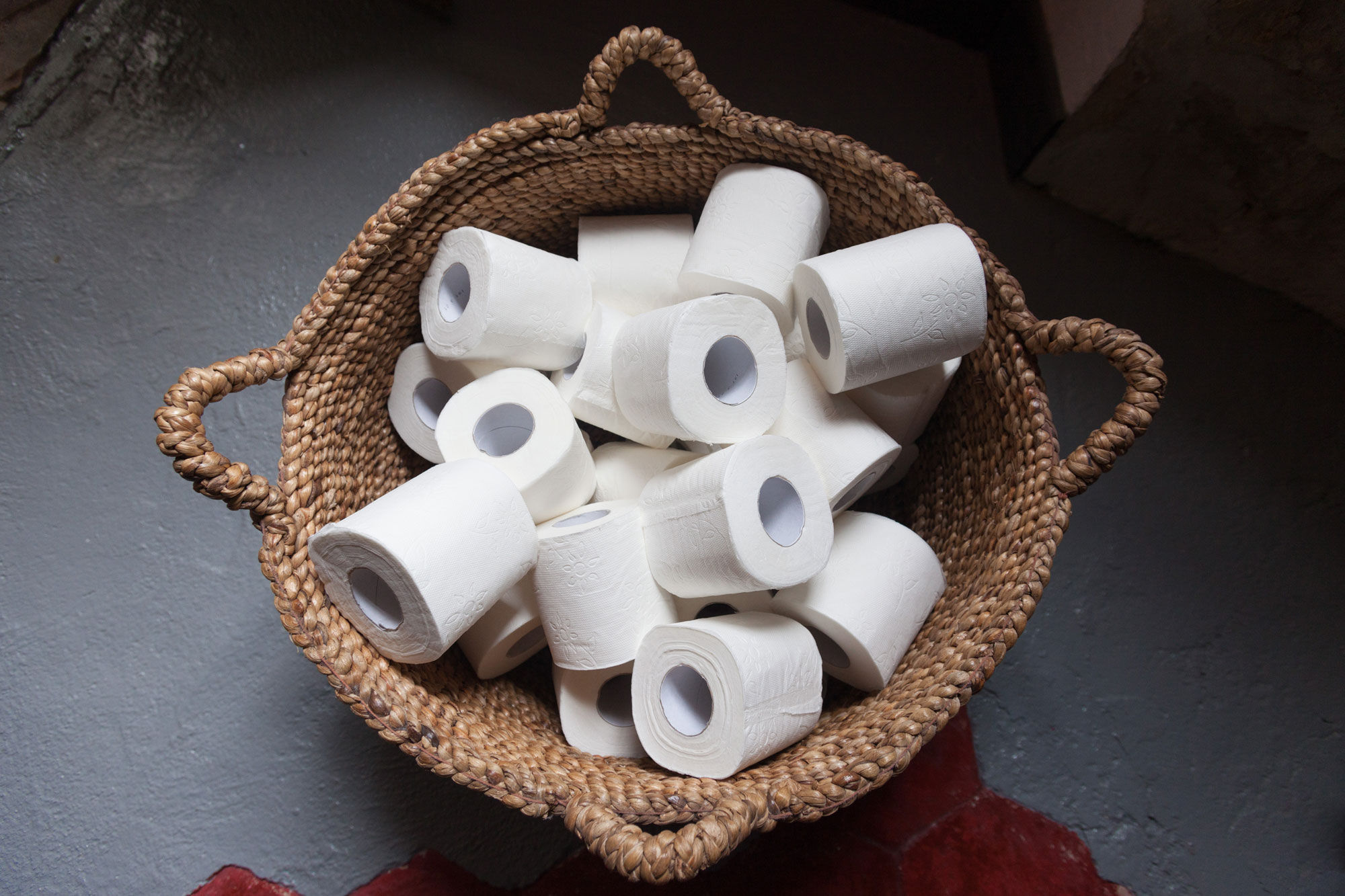 Tthe toilet paper rolls in a basket - Beautiful Homes