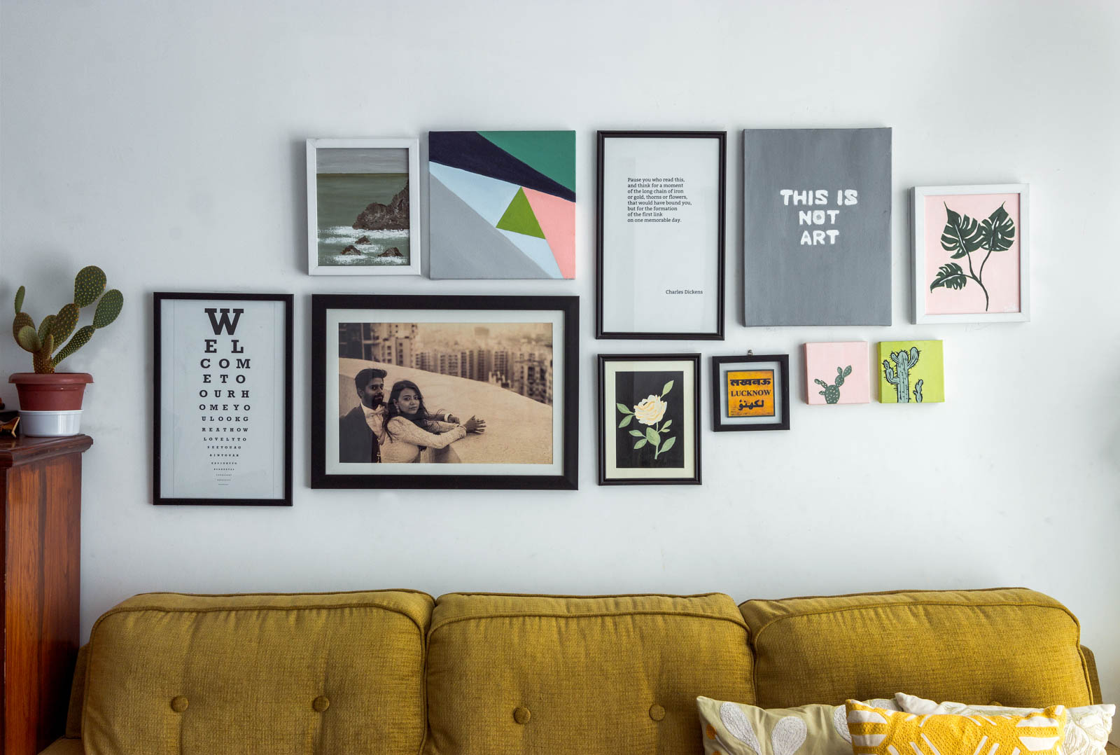 Pairing personal pictures in gallery wall design - Beautiful Homes