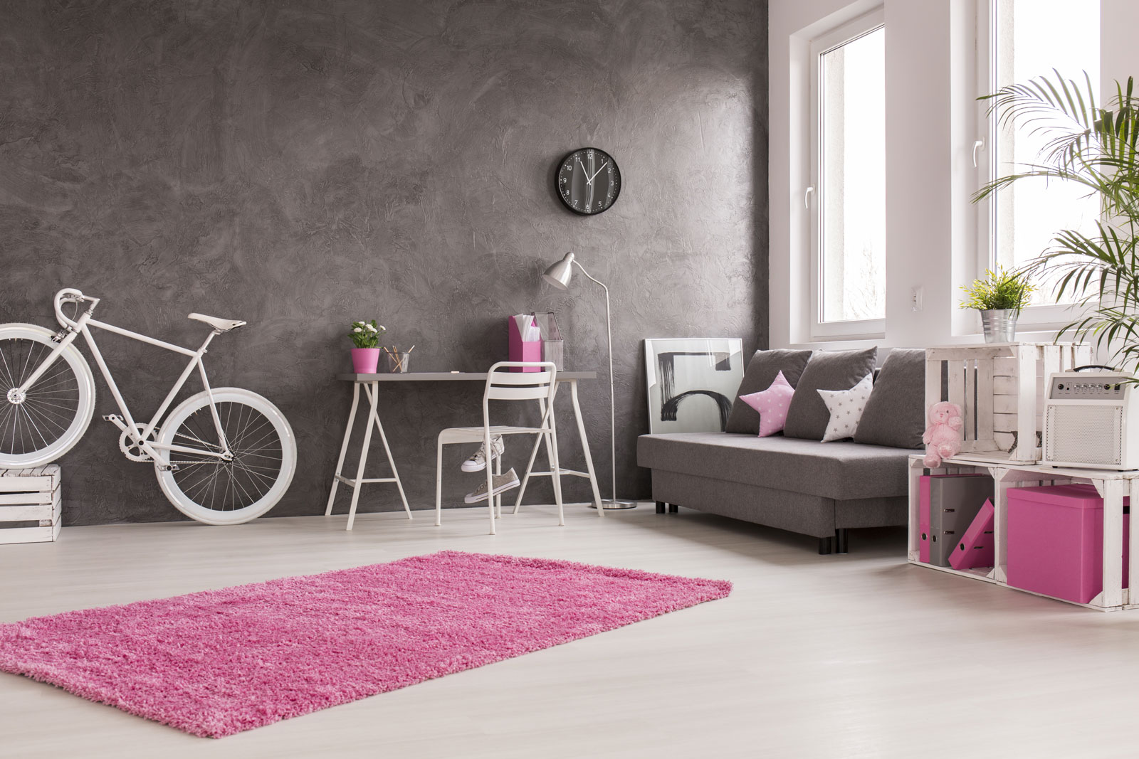 A room decorated with pink décor accessories and concrete walls - Beautiful Homes