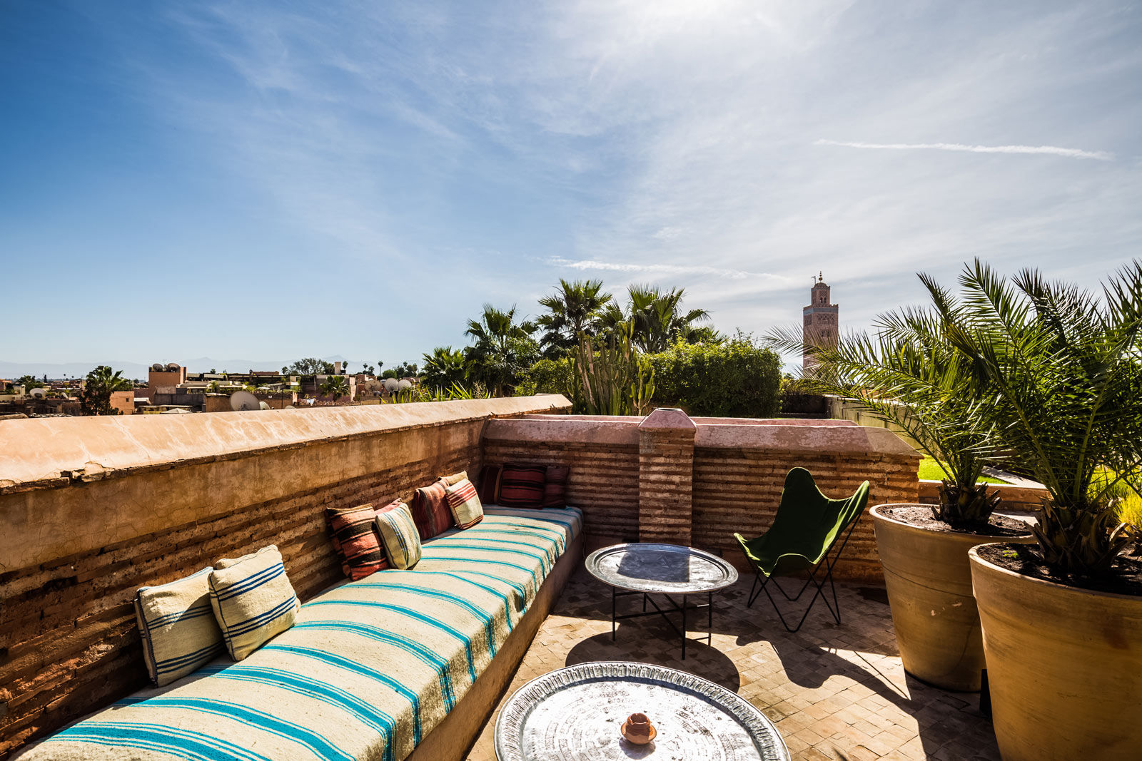 Section off the terrace in the subtlest way possible – by using large pots and planting them with large fronds or tall grasses - Beautiful Homes
