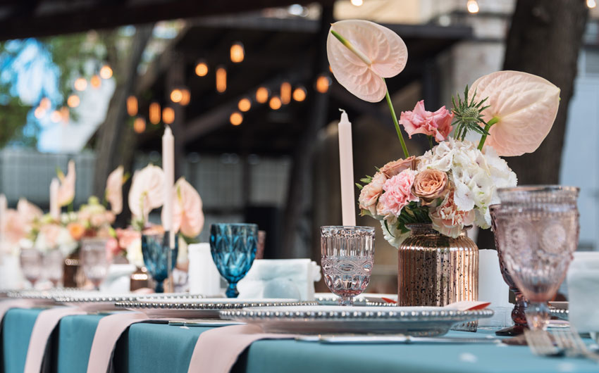 A table set up with blue table cloth
