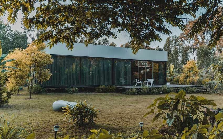 A prefab home with a lawn in front of it