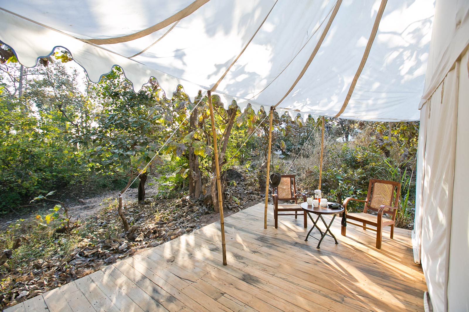 Set up a table for two under the shade of tents canopy - Beautiful Homes
