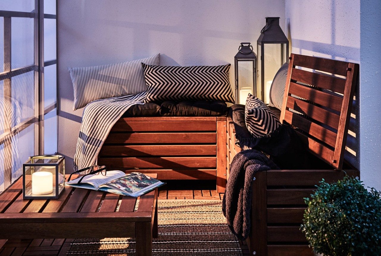 Balcony design with wooden chair and centre table for small spaces - Beautiful Homes