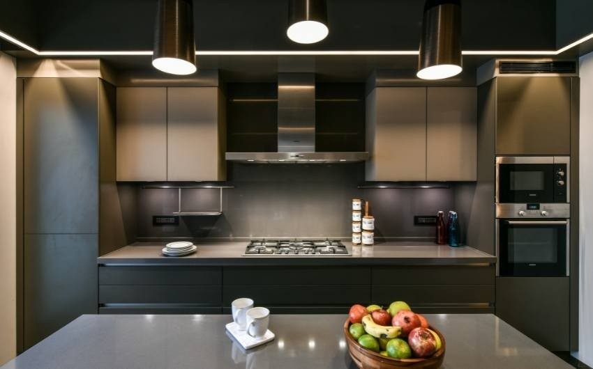 Metallic kitchen design trend with dark kitchen colour palette - Beautiful Homes