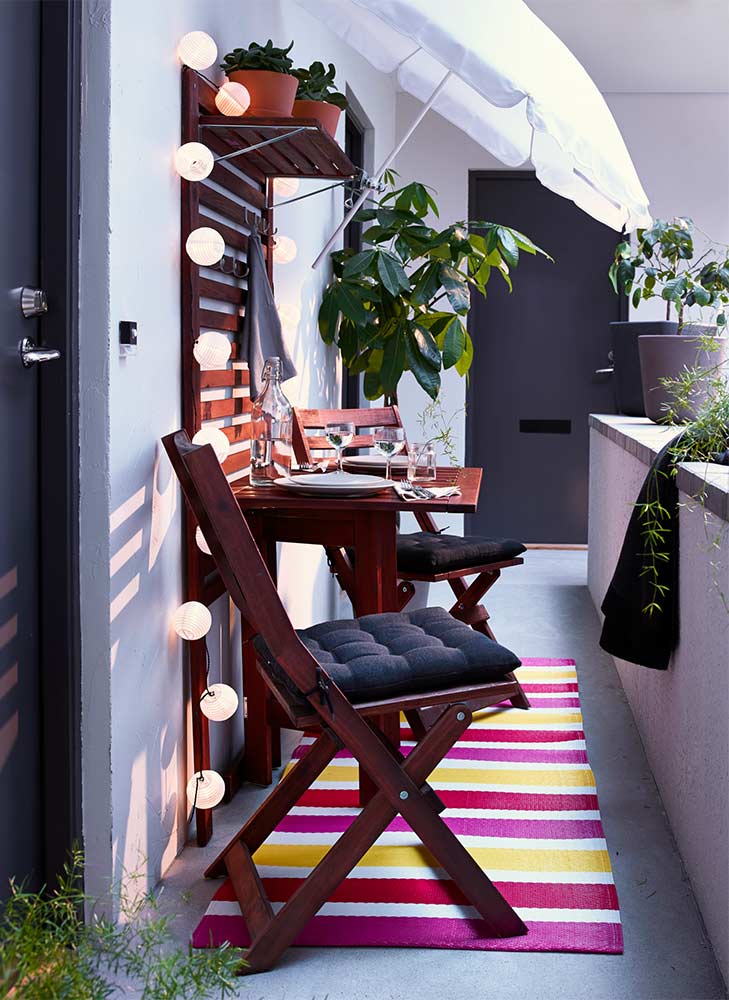 Small balcony ideas with folding chairs & colourful carpets - Beautiful Homes