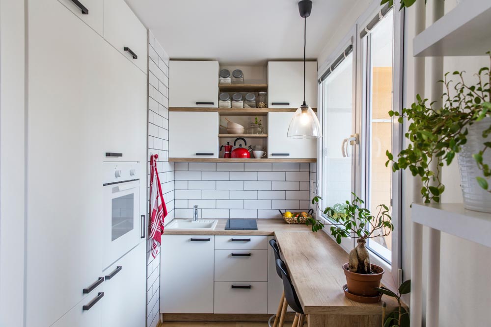 All white L-shaped modular kitchen design for small kitchen - Beautiful Homes