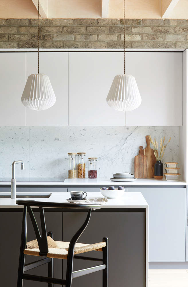Small modular kitchen luxe interiors with luxury faucets & designer pendant lights - Beautiful Homes