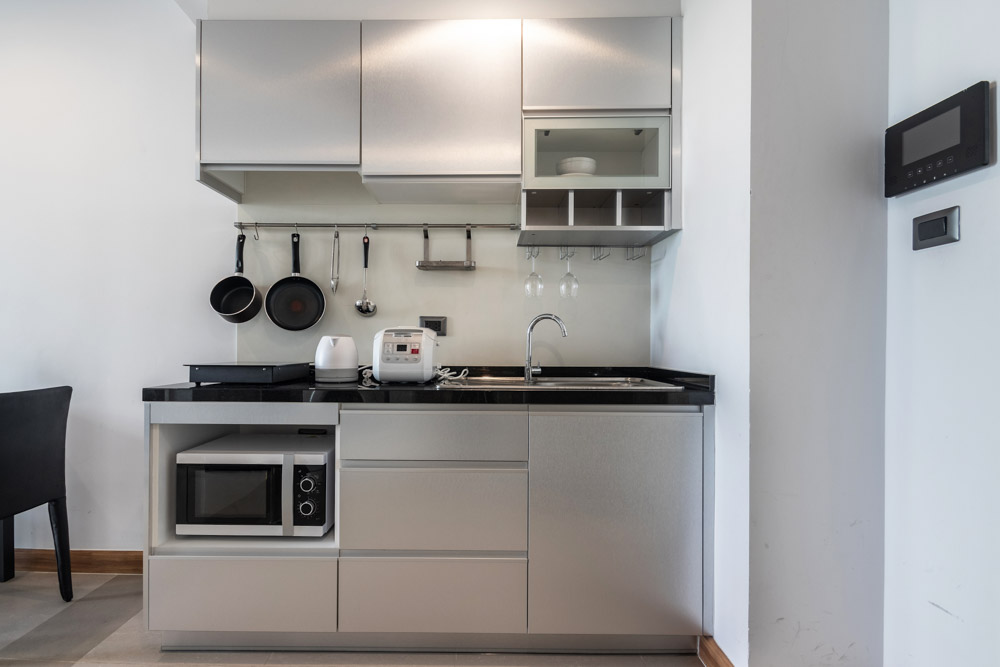 Highly reflective metallic small modular kitchen interior design - Beautiful Homes