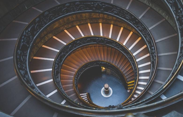 Concrete spiral staircase design with metallic railings - Beautiful Homes
