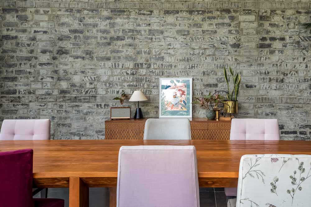 Use materials in their raw forms, such as exposed brick, to give your living room that lived-in look - Beautiful Homes