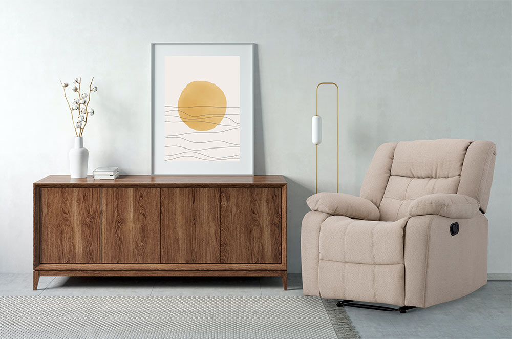 Cream recliner with artwork on a wooden cupboard - Beautiful Homes